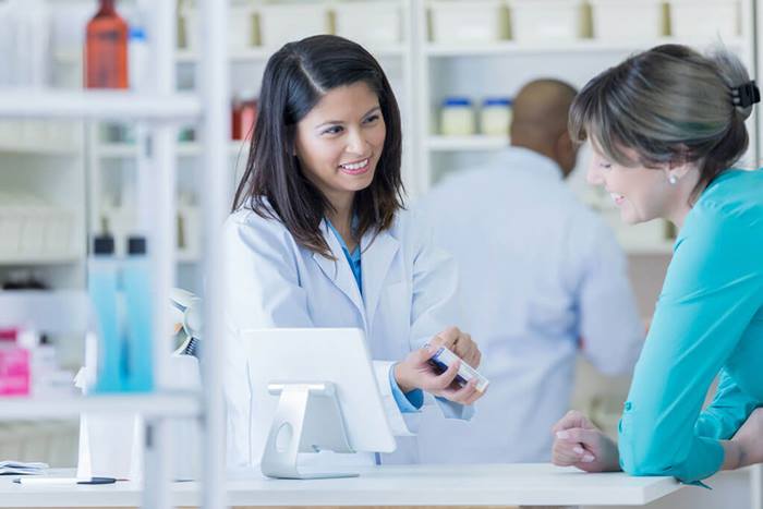 female medical professional showing information