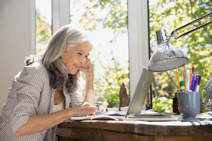senior woman using laptop at home