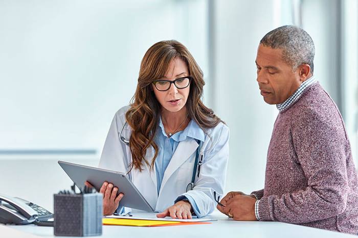 Doctor discussing patient program