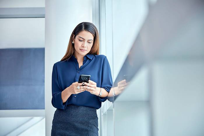 female reading information on cell