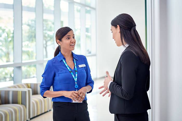 NHS doctor and sales person talking