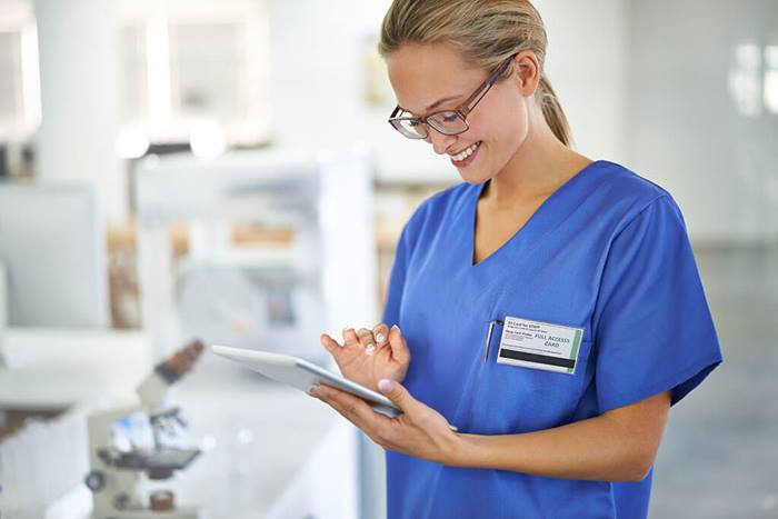 medical professional on tablet in hospital