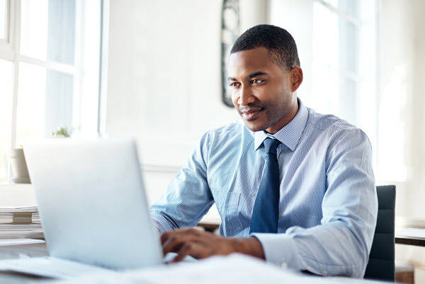 African American businessman working on laptop