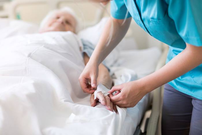 Patient and nurse in hospital