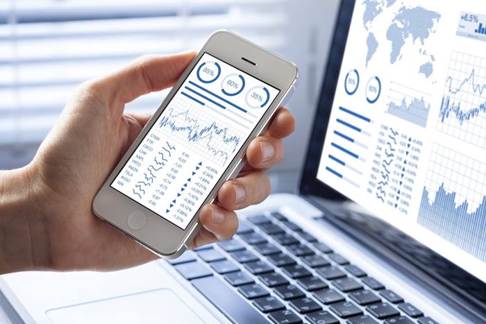 Investor analyzing stock market investments with financial dashboard