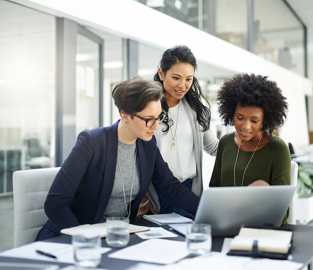 Businesswomen looking at laptop