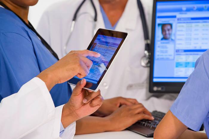 doctors using tablet in hospital