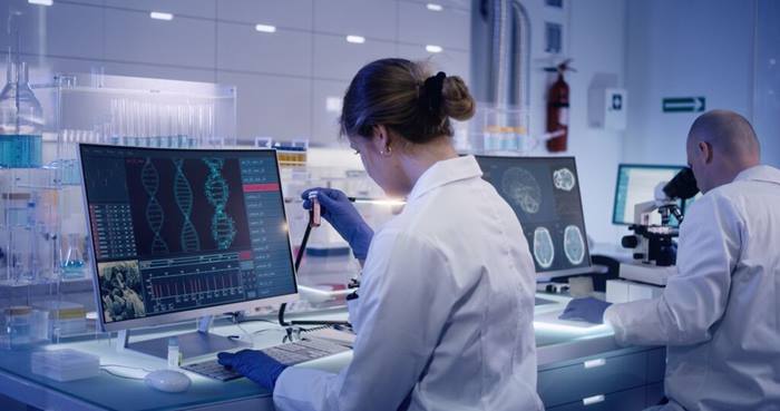 Research team studying DNA mutations Female doctor in foreground