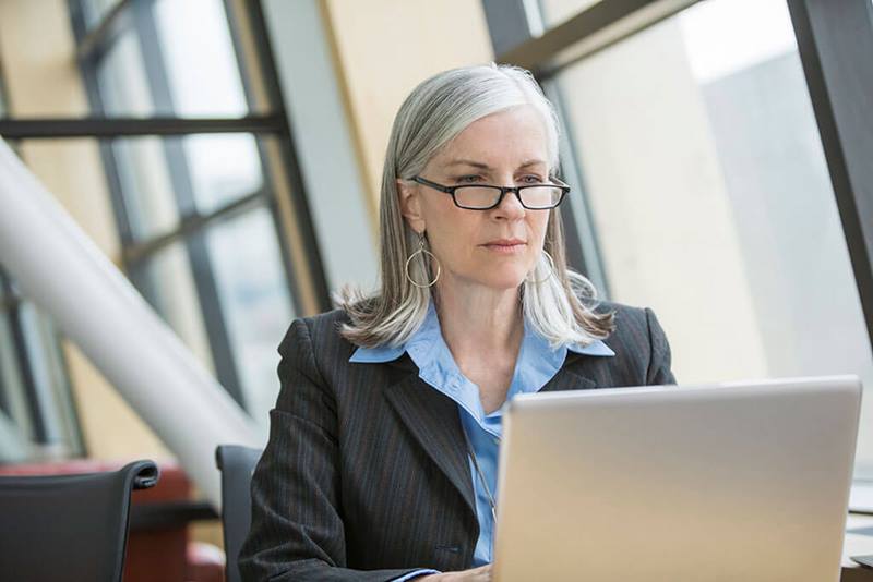 Business woman using laptop