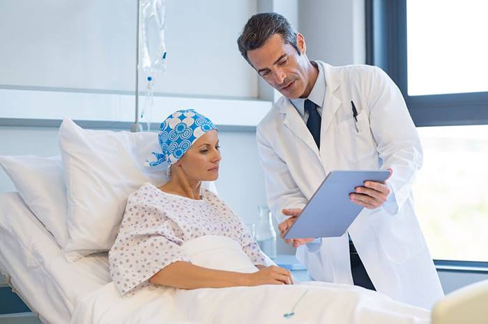 doctor showing medical chart to patient