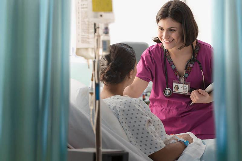 nurse talking to patient