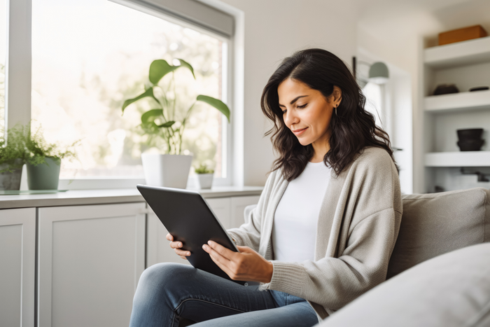 Happy woman using tablet