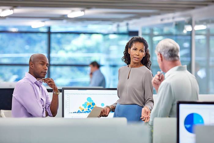 professional leading conversation with her colleagues