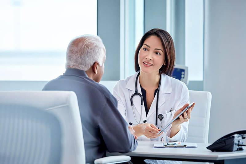 doctor engaged in conversation with patient