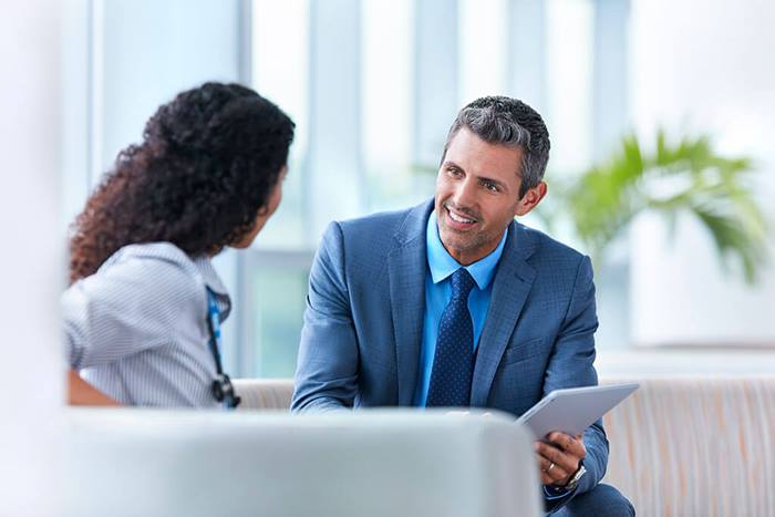 sales person with NHS doctor