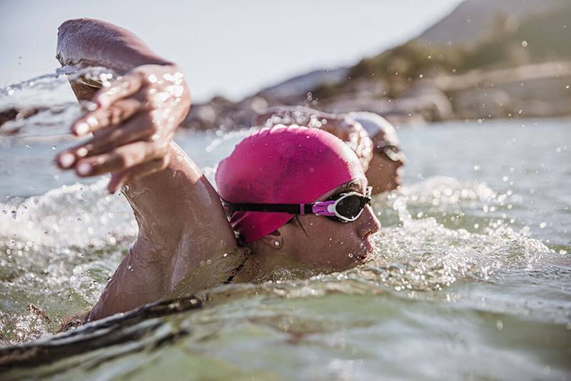 female swimmer in sunny ocean