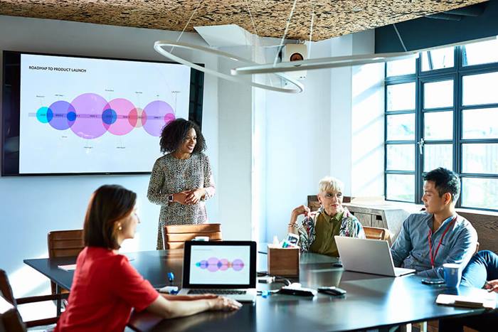 businesswoman leading team meeting in conference room