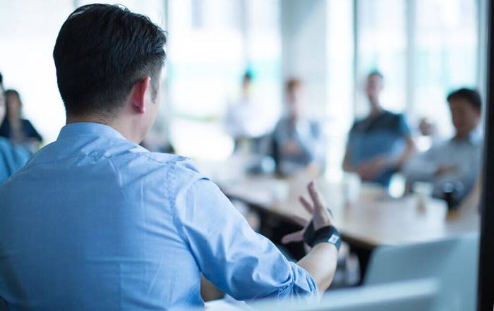 businessman talking to coworkers